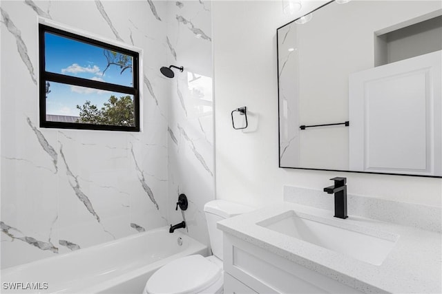 full bathroom with vanity, tiled shower / bath combo, and toilet