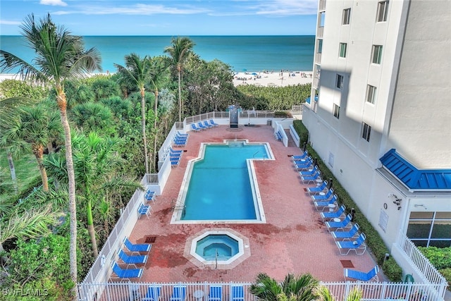 view of pool featuring a water view