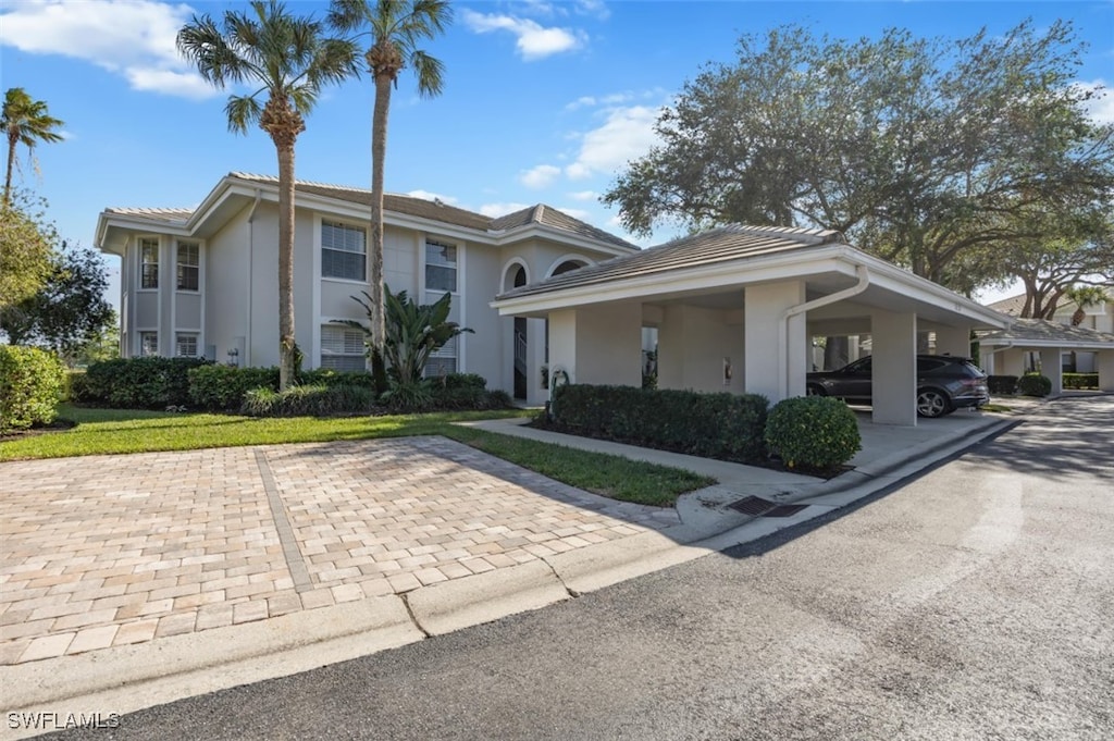 view of front of property featuring a carport