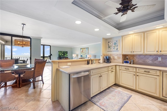 kitchen featuring dishwasher, sink, ornamental molding, decorative light fixtures, and kitchen peninsula