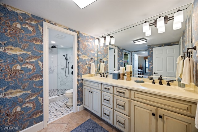 bathroom with tile patterned flooring, toilet, a shower, and vanity