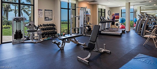 gym featuring a paneled ceiling