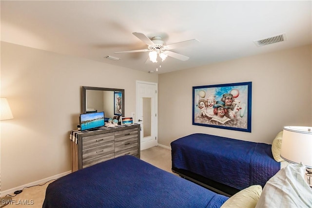 bedroom featuring light carpet and ceiling fan