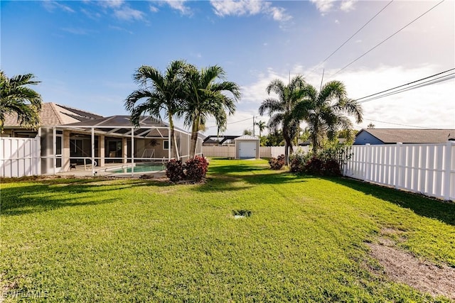 view of yard featuring a fenced in pool and a lanai