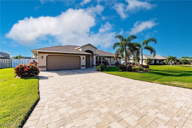 single story home with a garage and a front yard