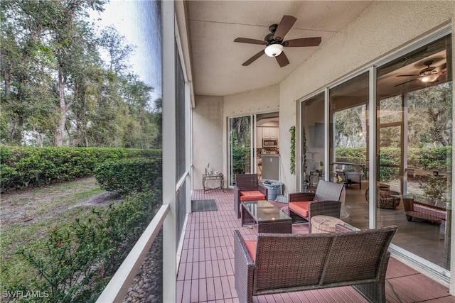 sunroom with a ceiling fan