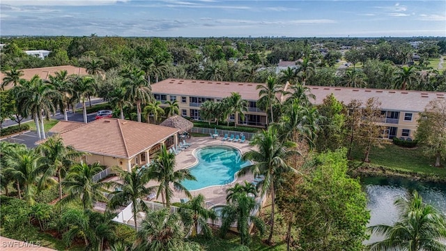 birds eye view of property with a water view