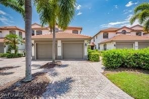 mediterranean / spanish house featuring a garage