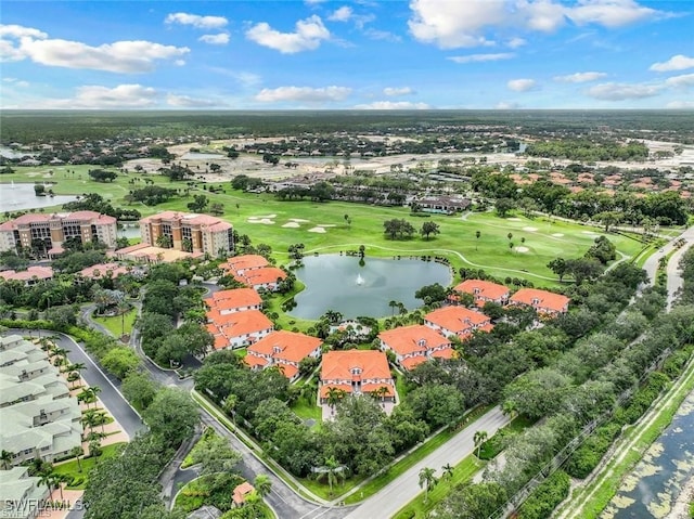 birds eye view of property featuring golf course view and a water view