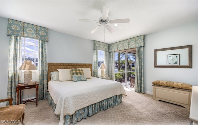 bedroom featuring carpet, baseboards, access to outside, and a ceiling fan