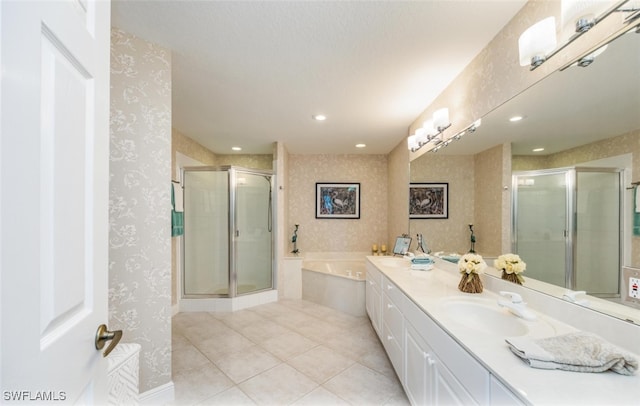 bathroom featuring wallpapered walls, a sink, tile patterned flooring, a shower stall, and a bath