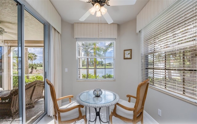 dining area featuring plenty of natural light, ceiling fan, and baseboards