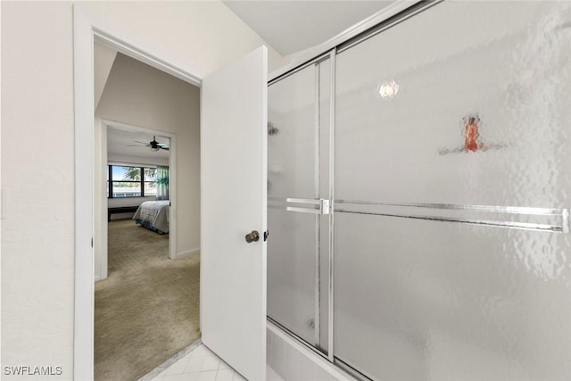 bathroom with tile patterned floors, walk in shower, and ceiling fan