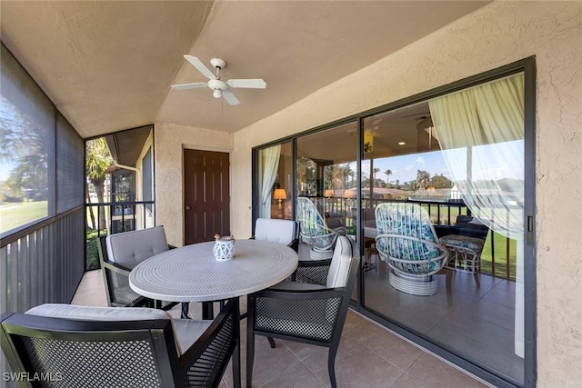 sunroom featuring ceiling fan and lofted ceiling