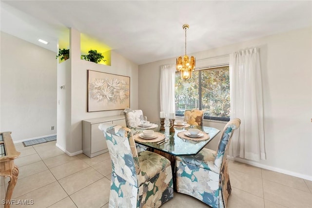 tiled dining space with vaulted ceiling and a notable chandelier