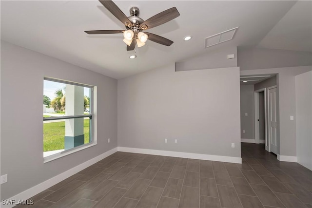 empty room with ceiling fan and lofted ceiling