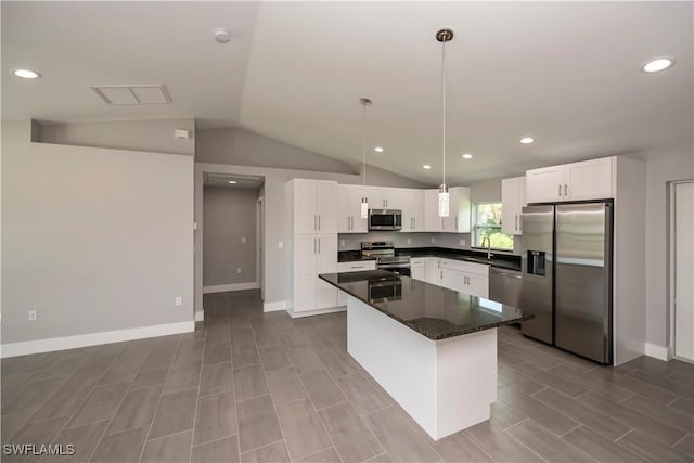 kitchen featuring a center island, white cabinets, stainless steel appliances, and sink