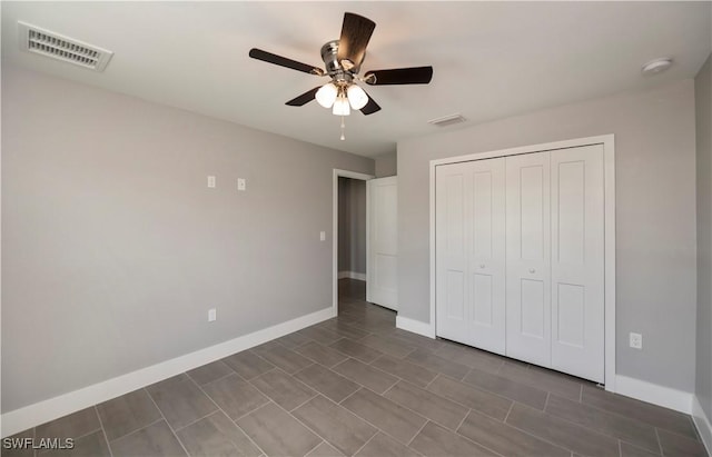 unfurnished bedroom with a closet and ceiling fan