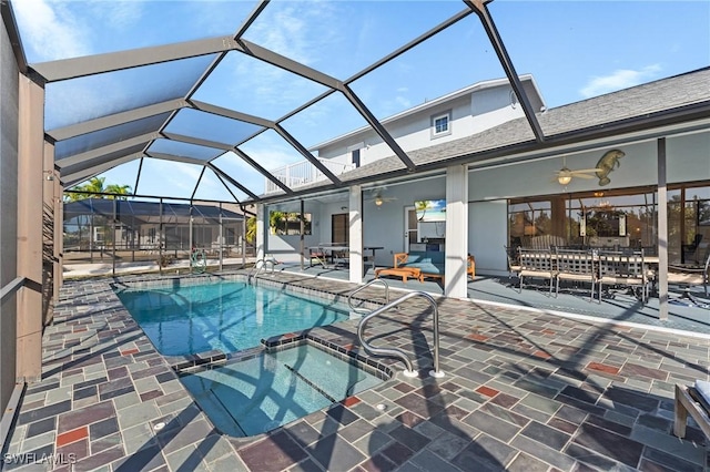 view of pool featuring an in ground hot tub, a patio, ceiling fan, and a lanai