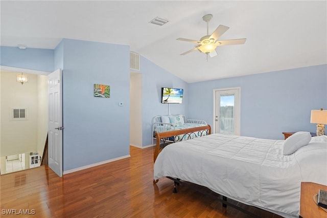 bedroom with ceiling fan, vaulted ceiling, and hardwood / wood-style flooring