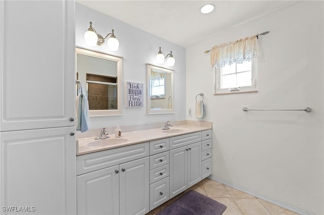 bathroom featuring tile patterned flooring and vanity