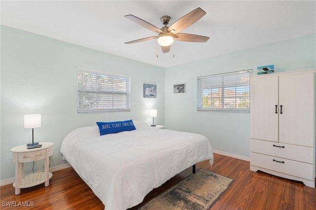 bedroom featuring ceiling fan and dark hardwood / wood-style flooring