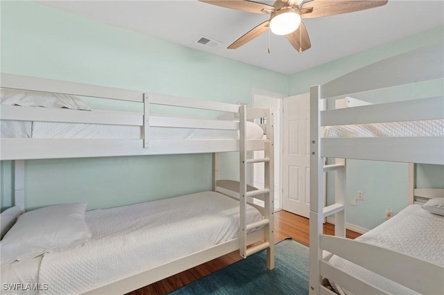 bedroom featuring ceiling fan and hardwood / wood-style floors