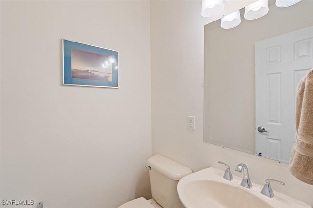 bathroom with sink and toilet