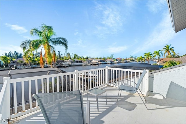 wooden deck with a water view