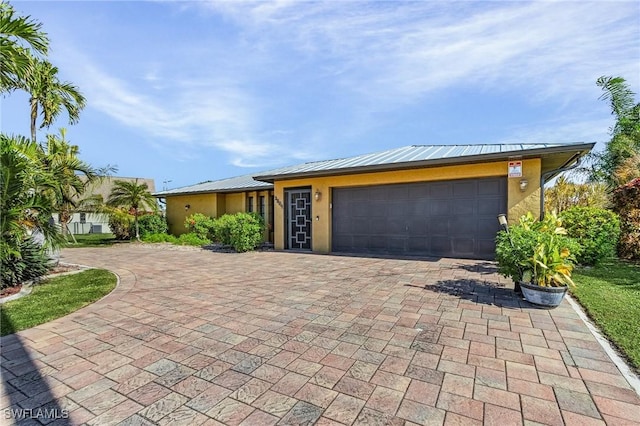 ranch-style home featuring a garage