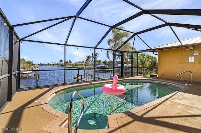 view of pool with a boat dock, a water view, a patio, and glass enclosure