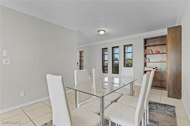 dining space featuring built in features, light tile patterned flooring, and ornamental molding