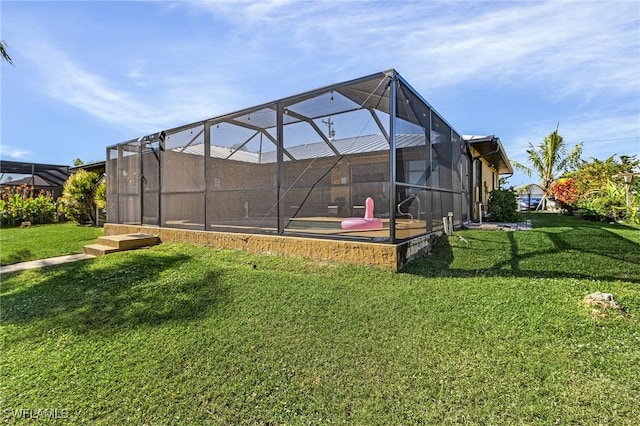 view of yard with glass enclosure