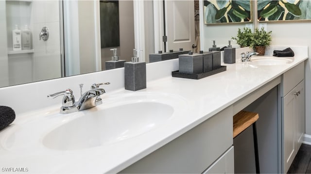 bathroom featuring vanity, a shower with shower door, and wood-type flooring