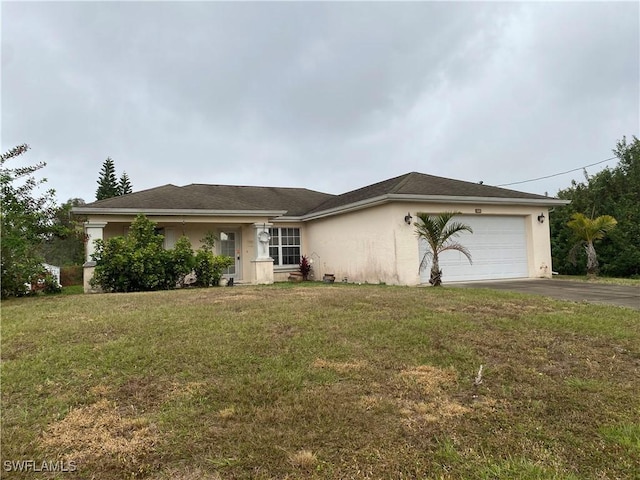 single story home featuring a front lawn and a garage