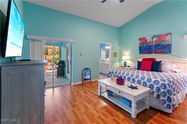 bedroom with lofted ceiling, access to outside, ensuite bathroom, light hardwood / wood-style flooring, and ceiling fan