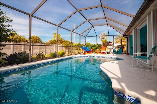 view of pool featuring a patio and a lanai