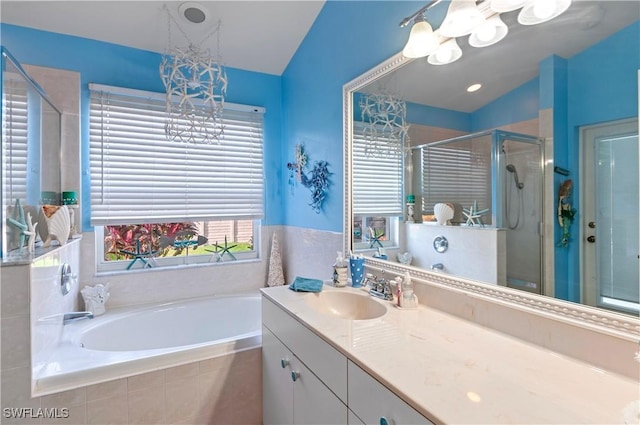 bathroom with vanity, independent shower and bath, and lofted ceiling