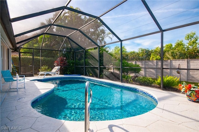 view of pool featuring a patio and a lanai