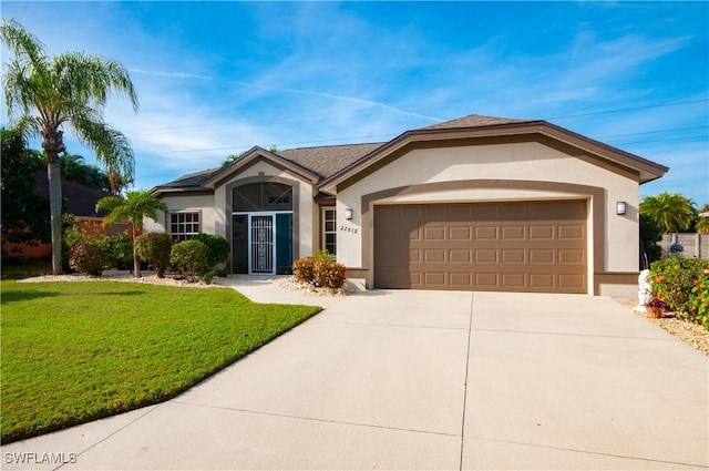 ranch-style home featuring a front yard and a garage