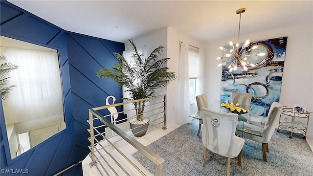 dining space featuring an inviting chandelier and a wealth of natural light