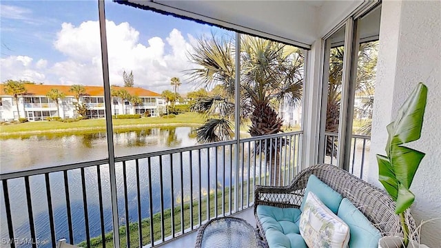 balcony with a water view and a residential view