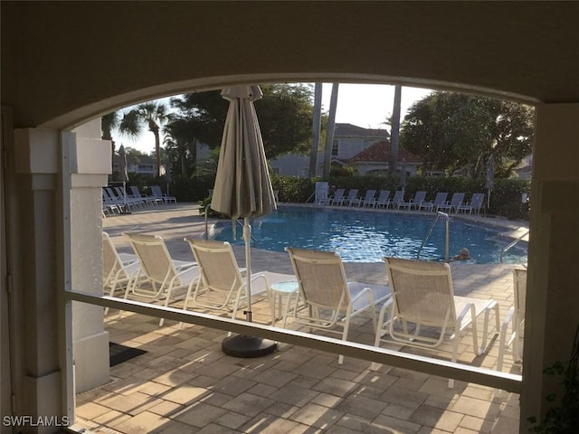 community pool featuring a patio area