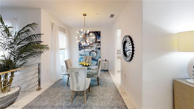 dining area with visible vents and a notable chandelier