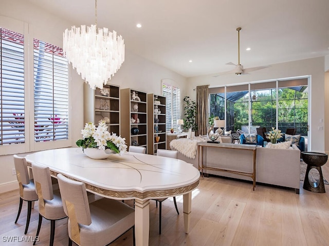 dining space featuring a notable chandelier, plenty of natural light, and light hardwood / wood-style floors