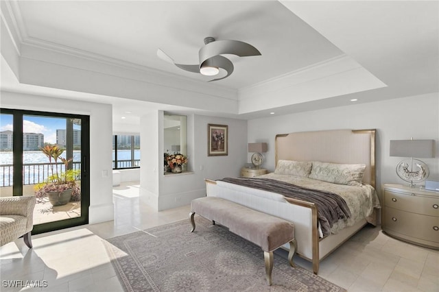 tiled bedroom with access to exterior, ceiling fan, crown molding, a tray ceiling, and a water view