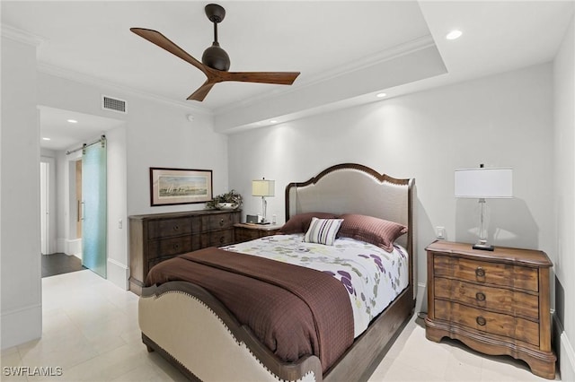 bedroom featuring light tile patterned floors, a barn door, ceiling fan, and ornamental molding