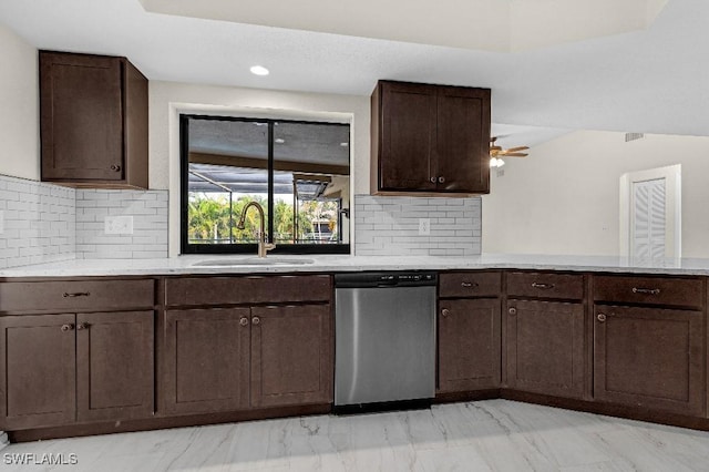 kitchen with dishwasher, dark brown cabinets, backsplash, and sink