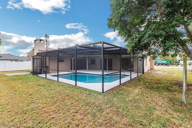 view of swimming pool with a lawn, a lanai, and a patio