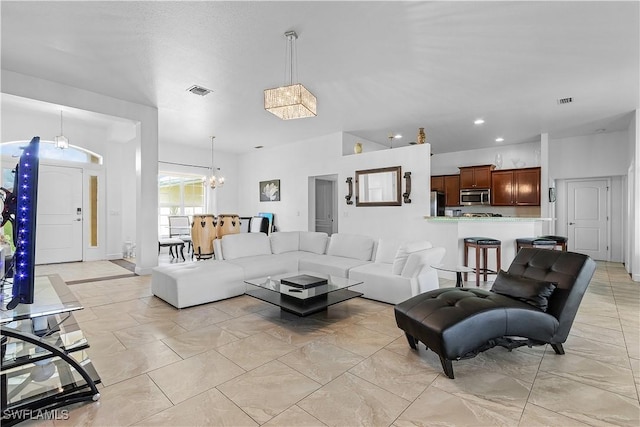 living room featuring a notable chandelier